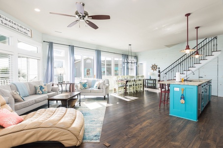 Open Living and Dining Space – Relax after a day at Folly Beach in this coastal-inspired home.