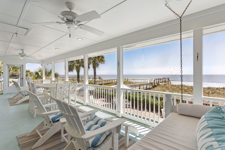 Take in the sights and sounds of the ocean from your screened-in porch