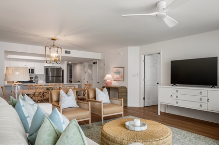 Relax in your beautifully designed open-concept living space, where coastal colors and modern comfort create the perfect retreat for your getaway.