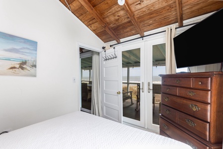 Your queen bedroom has private access to the screened-in porch