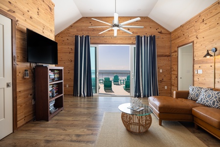 Pass through the living room to find your top deck with panoramic views of the coastline