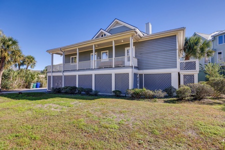 Step around back to your private balcony overlooking a large grassy yard