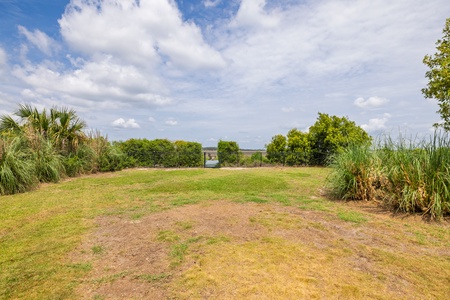 Your spacious back lawn takes you out to your private dock