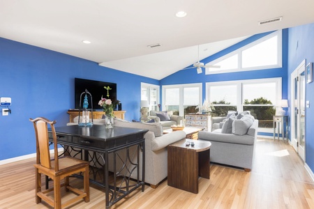The open-concept floorplan makes for a seamless transition from your dining table to your living room