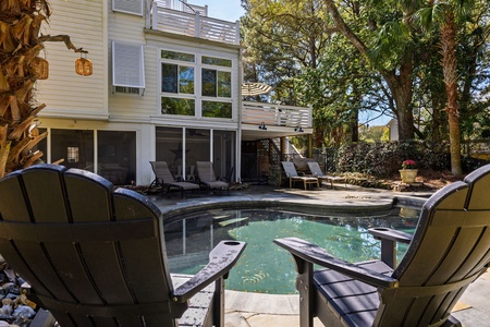 Dive into your private pool oasis surrounded by tropical palms and comfortable loungers for the ultimate relaxation retreat.