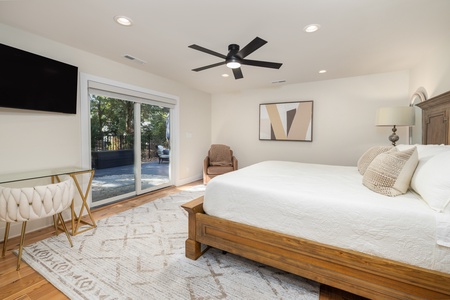 Your primary bedroom features a king bed, en suite bathroom, and private access to your backyard