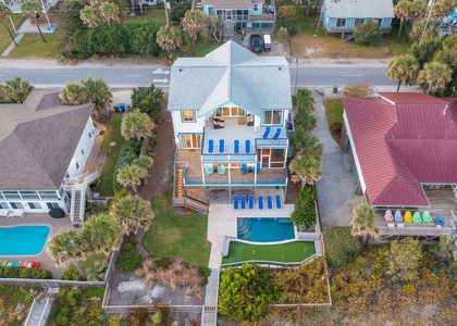 This aerial shot captures it all: oceanfront access, resort-style amenities, and total privacy.