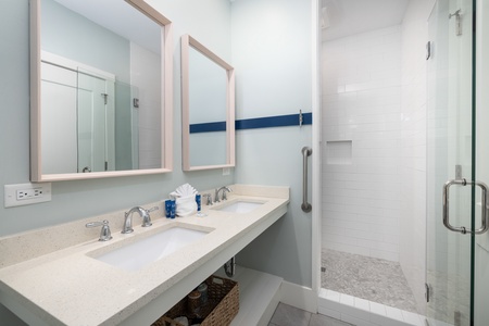 The first upstairs queen features its own en suite bathroom with large walk-in shower