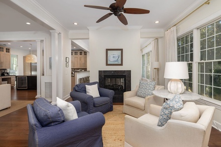 Unwind in your elegant sitting room with a cozy fireplace, perfect for relaxing evenings together.