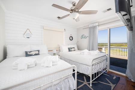 Your second bedroom offers two full beds and direct access to the back deck