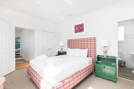 Your upstairs queen bedroom features an en suite bathroom