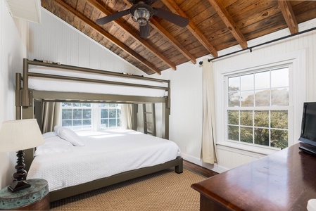 Your primary bedroom features a unique queen-over-king bunk bed and loads of natural light