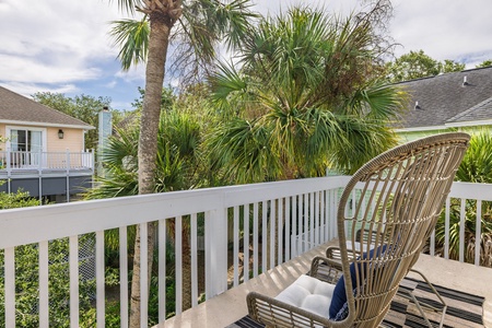 Private deck with palm trees for privacy.