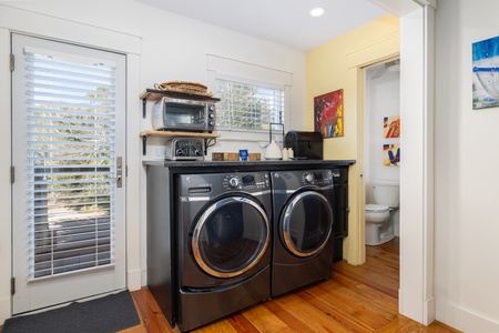 Past the washer and dryer is your half bathroom