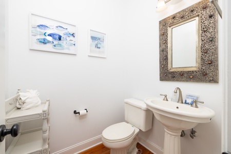 A hallway half bath is available