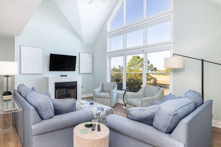 Enjoy movie night or catch the game by the cozy fireplace.