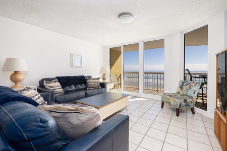 Relax in your bright oceanfront living room where coastal breezes flow through sliding doors from your private balcony.