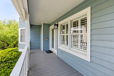 A covered front porch leads you to your front door