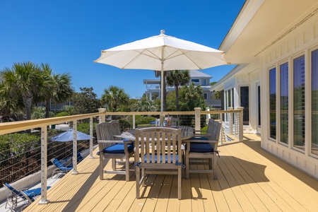 Enjoy lunch poolside under the umbrella
