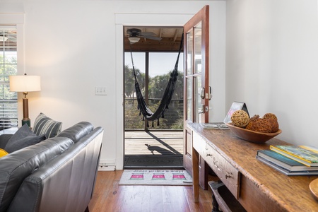 Enter your front door through the screened in front porch