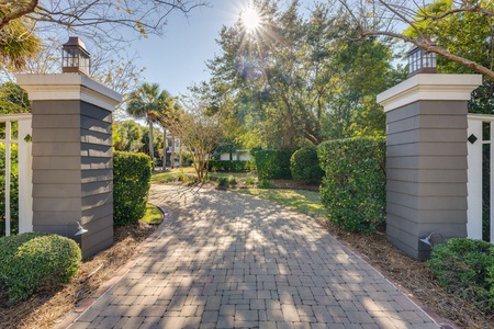 Take the brick driveway to enter your private property