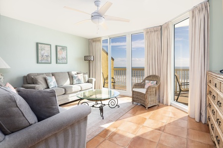 Relax in your coastal retreat with comfortable seating and stunning ocean views from your private balcony.