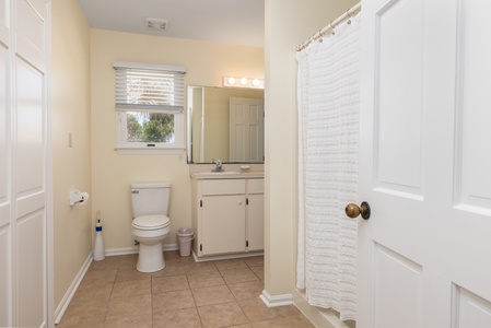 Your queen bathroom features a tub-shower combo and large vanity