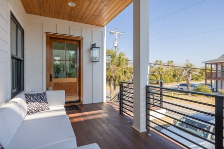 A covered patio welcomes you before entering the home