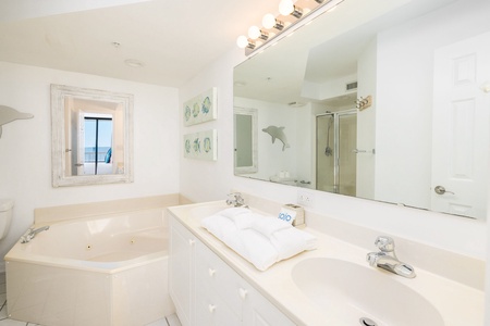 Your en suite primary bathroom includes an oversized jacuzzi tub and a dual vanity