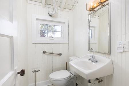 Your main bathroom is split between a shower room and a water closet and features a washer and dryer