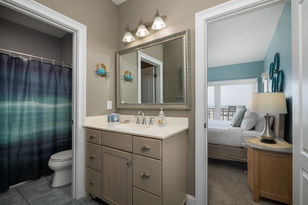 Your downstairs king features an en suite bathroom with tub-shower combo