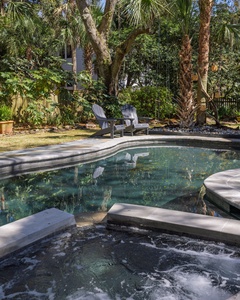 Unwind in your private oasis with a sparkling pool and bubbling hot tub surrounded by lush tropical palms.
