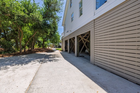 This coastal property offers convenient covered parking and plenty of driveway space