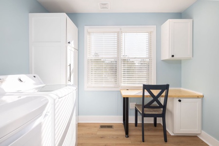 The sunny pantry and laundry room includes a desk so you can catch up on emails.
