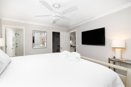 Your primary bedroom sits just off the main living space and features an en suite bathroom