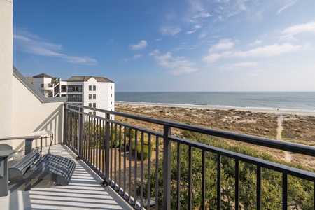 Step onto your private balcony and soak in breathtaking ocean views stretching to the horizon, with direct beach access just steps away.