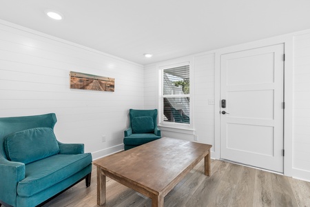 Enter your cozy downstairs living space through the covered patio