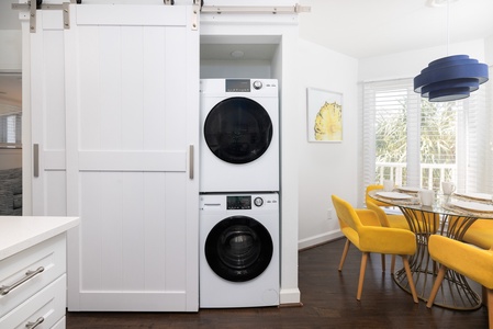Your washer and dryer are just behind these sliding farm doors