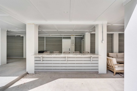 Relax outdoors in your covered patio with full-sized bar top and lounge area