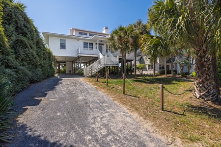 A large driveway with a covered garage is perfect for parking