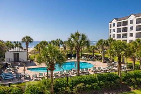 The Wild Dunes Resort features a swimming pool surrounded by palm trees