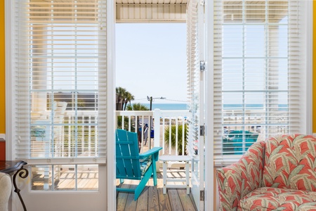 Step through French doors to your private covered patio