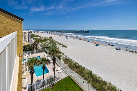 View the on-site pool from your private balcony