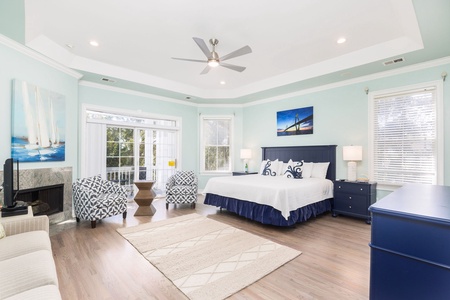 Unwind in your spacious upstairs primary bedroom with a King bed, en suite bathroom, and private balcony