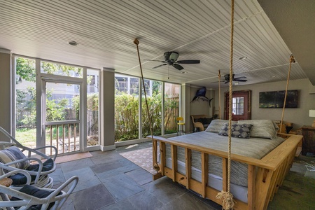 Spend a lazy day in the shade on the bed swing