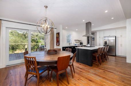 Open dining area connects seamlessly to the kitchen and living space, ideal for gathering after a day at the beach.