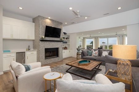 Steps from the dining room is your luxurious living room with tons of seating and seashell fireplace