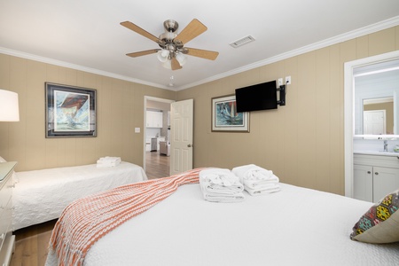 Your queen and twin bedroom features a private en suite bathroom