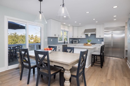 The dining area flows into the kitchen and the living room.