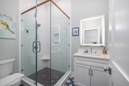 The queen en suite has a glass walk-in shower